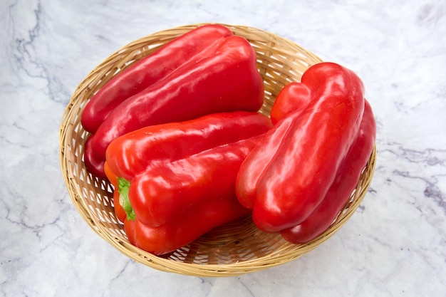 wicker basket with fresh red peppers