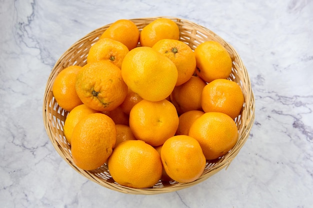 wicker basket with fresh tangerines