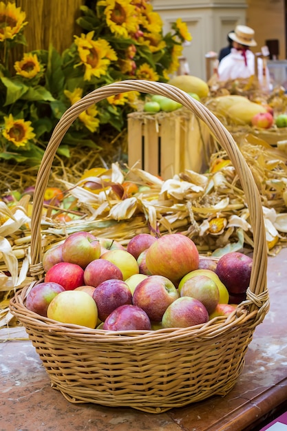 Wicker basket with red apples