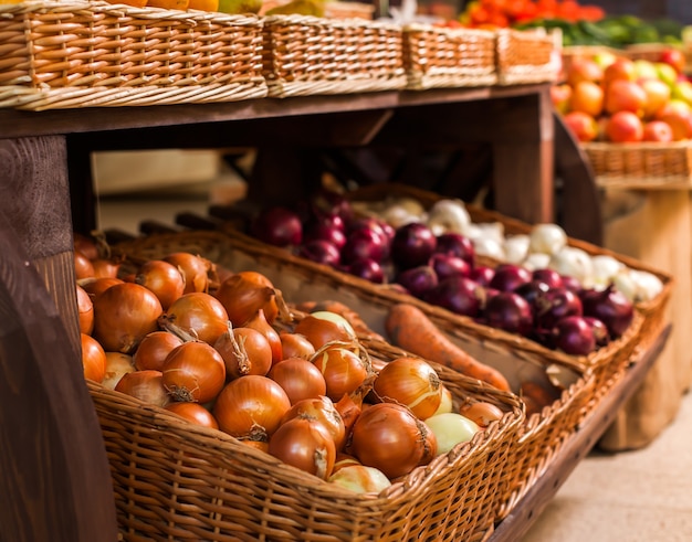 Wicker boxes with ripe onion.