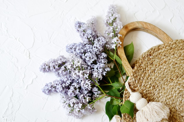 Wicker handbag with lilac flowers