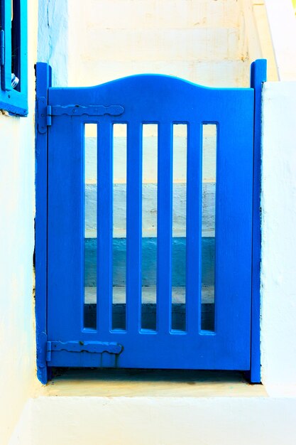 Wicket painted in traditional blue color, Santorini, Greece