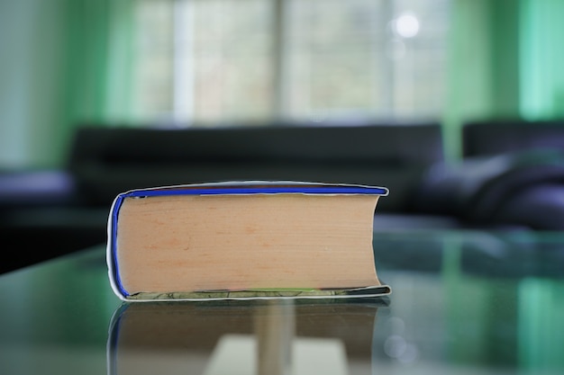 wide angle lens close up of pocket book with blur living room