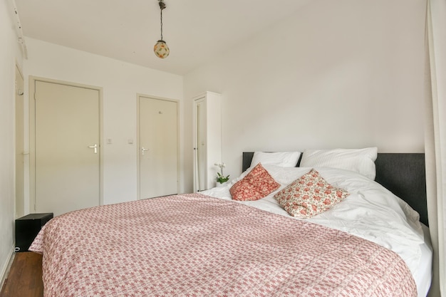 Wide bed in light bedroom