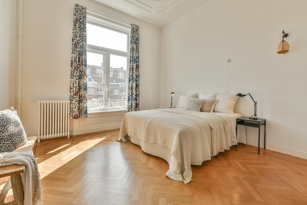 Wide bed in light spacious bedroom