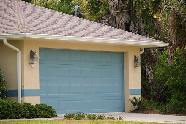 Wide garage double door and concrete driveway of new modern american house