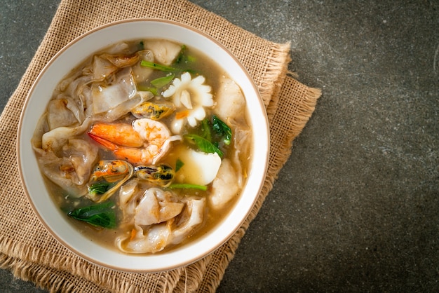 Wide Rice Noodles with Seafood in Gravy Sauce - Asian food style