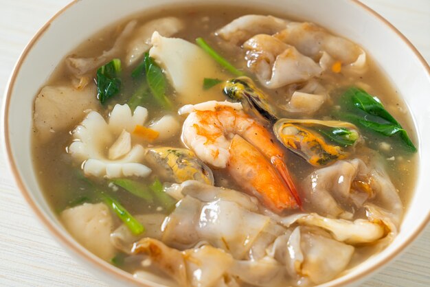 Wide Rice Noodles with Seafood in Gravy Sauce - Asian food style