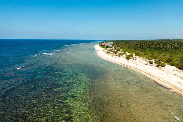 Wide sandy beach with ocean surf and waves philippines