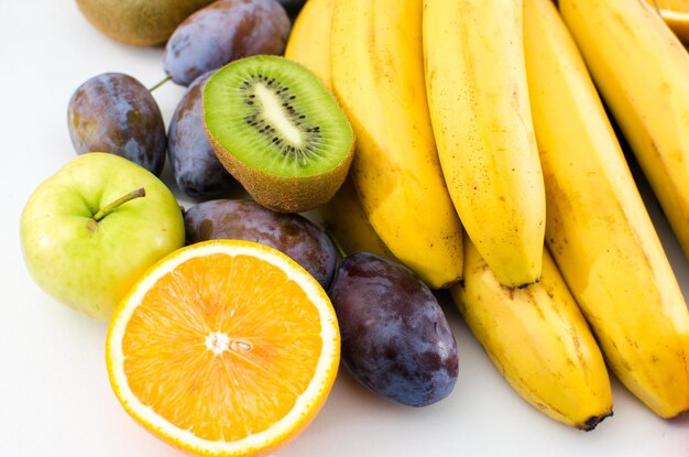 A wide variety of fruits on white background