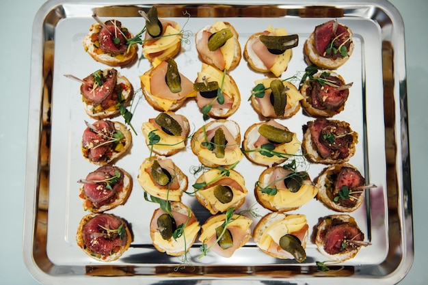 A wide variety of snacks on the table for guests Shrimp boiled pork various types of meat and other products