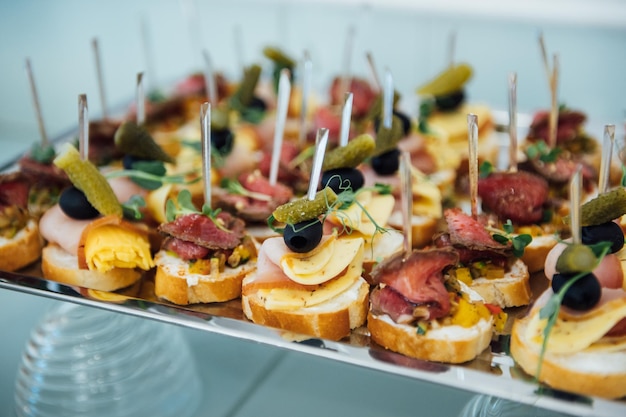 A wide variety of snacks on the table for guests Shrimp boiled pork various types of meat and other products