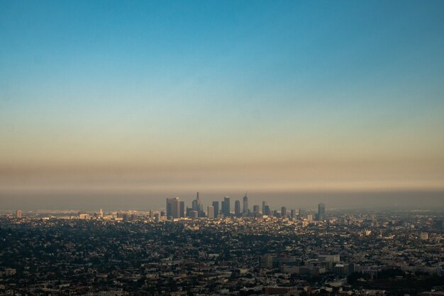 Wide view of Los Angeles city with polluted sky.