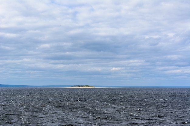 The widest place of the Volga River. Beautiful landscape on a cloudy summer day.