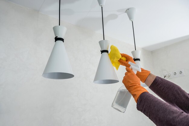 Wife in the kitchen wipe in yellow gloves, cleaning for care and protect yourself. hygiene housework