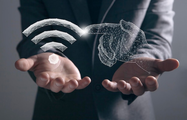WiFi and hands from the network Man holding in his hand