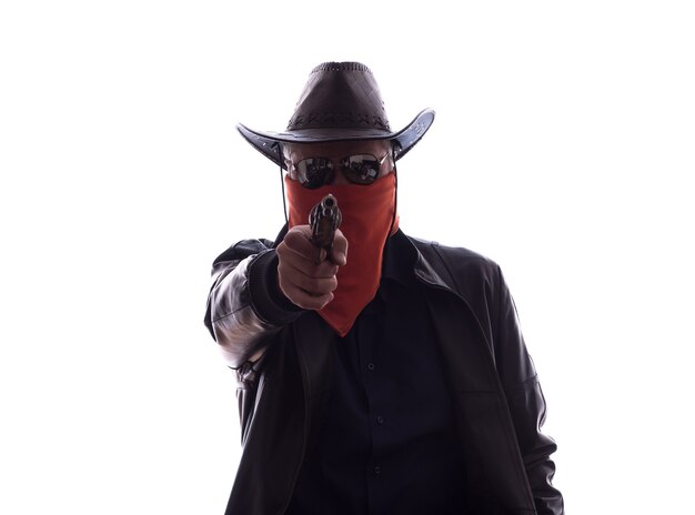 Wild West cowboy with weapons and red mask