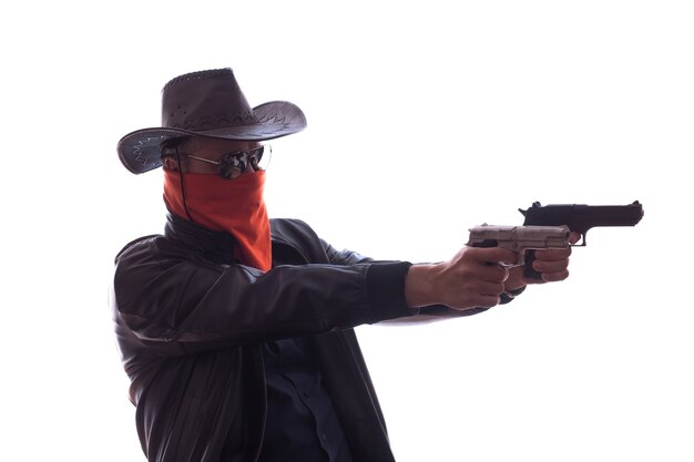 Wild West cowboy with weapons and red mask