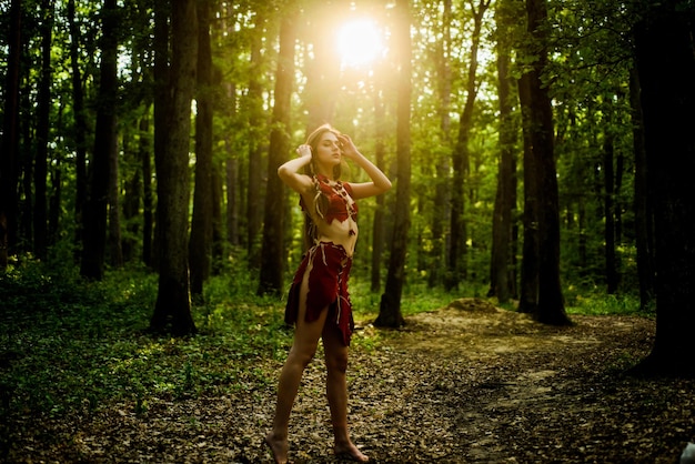 Wilderness of virgin woods female spirit mythology she belongs\
tribe warrior women wild attractive woman in forest folklore\
character living wild life untouched nature sexy girl wild\
human