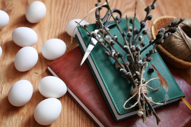 Willow and egg on a wooden background