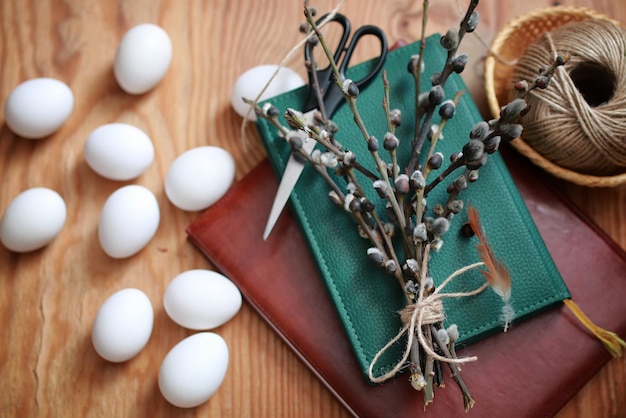 Willow and egg on a wooden background