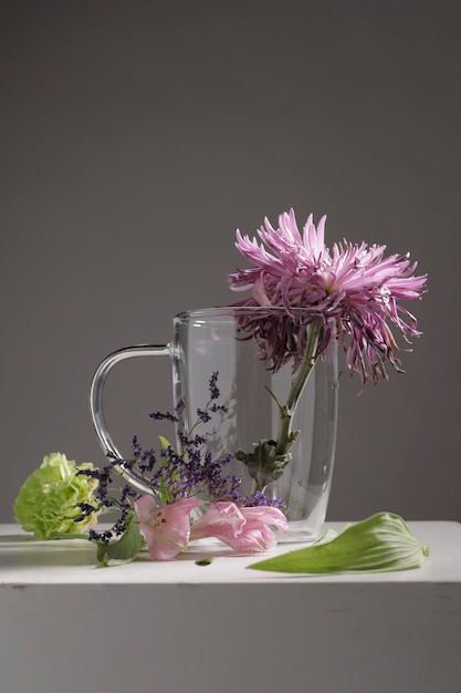 Wilted flowers in glass cup