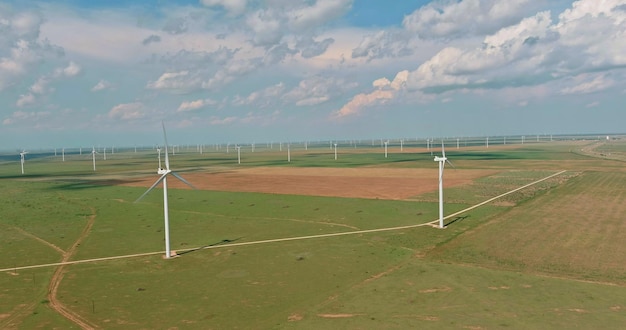 On wind electricity farm in texas us one can see a row of windmill turbines which produce renewable