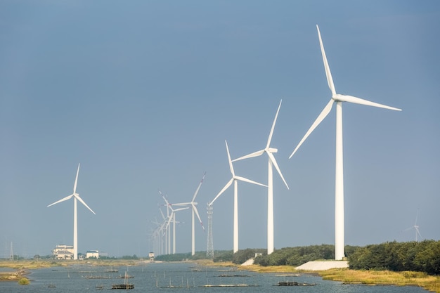 Wind farms on the coast sustainable energy background