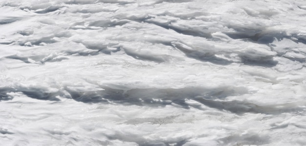 Wind form ice texture on winter mountain snow surface (five shots stitch image)