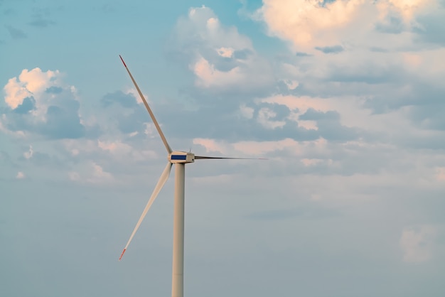 Wind power generator on sky background