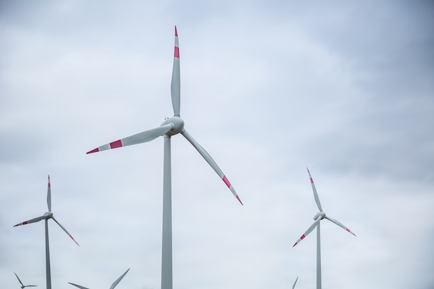 Wind power. Wind energy. Electrical energy. Several wind turbines in power generation.