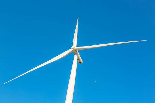 Wind turbine generator on blue sky