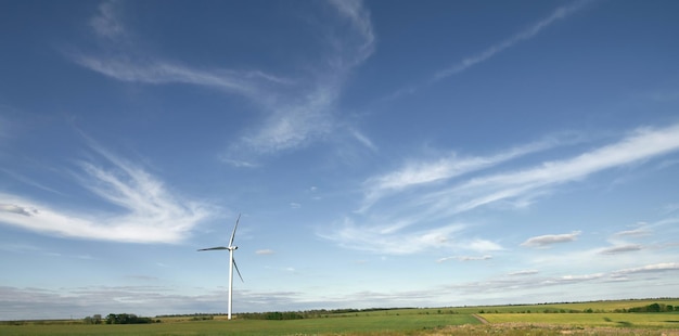 Wind turbine renewable energy source summer landscape with blue sky in natural landscapes