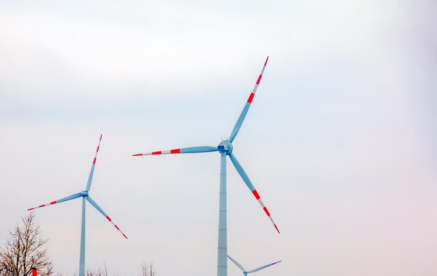 Wind turbine station windmill park next to the road in Austria in cloudy weather