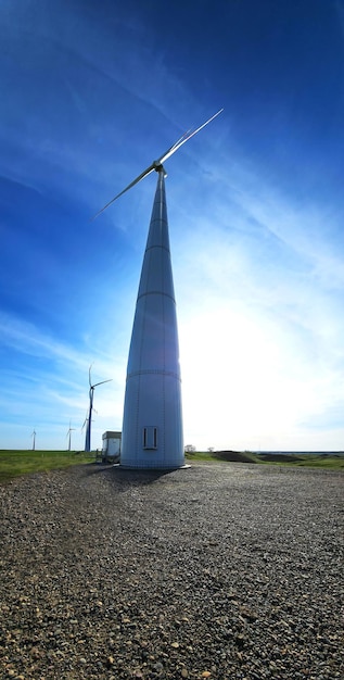 A wind turbine with the letter m on it
