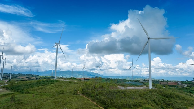 Wind Turbines Windmill Energy Farm Windmill on blue sky puffy clouds