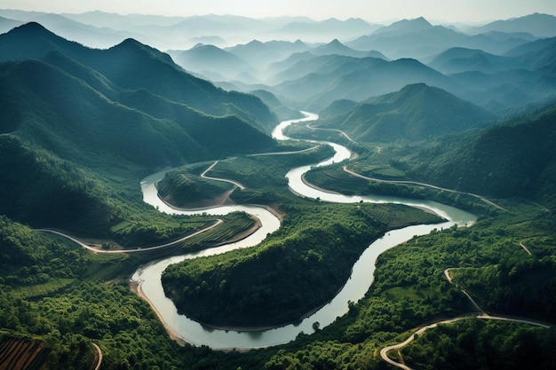 A winding river runs through a valley with mountains in the background.