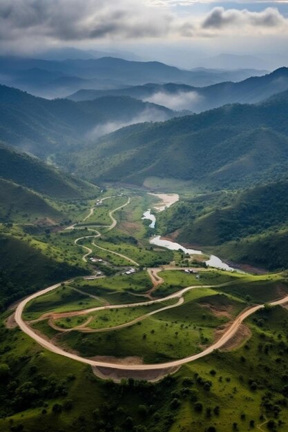 Photo a winding road is surrounded by mountains and trees