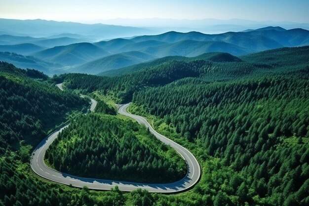 Photo a winding road in the mountains with a winding road in the foreground