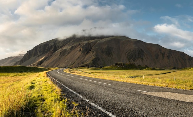 Winding road at the side of the mountain in rural part of east iceland