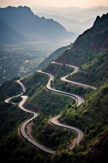 Photo a winding road with a mountain in the background