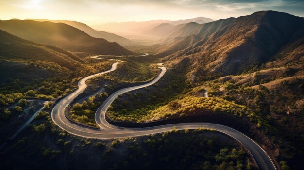 a winding road with a sunset in the background