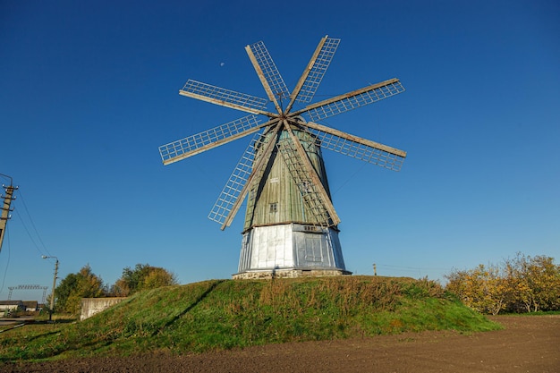 windmill dutch type against blue sky close up