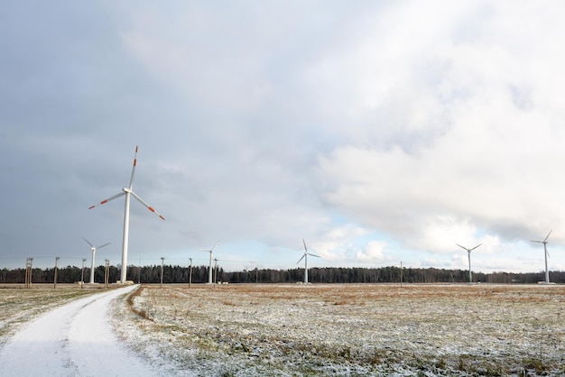 Windmill farm or wind park with high wind turbines for generation electricity