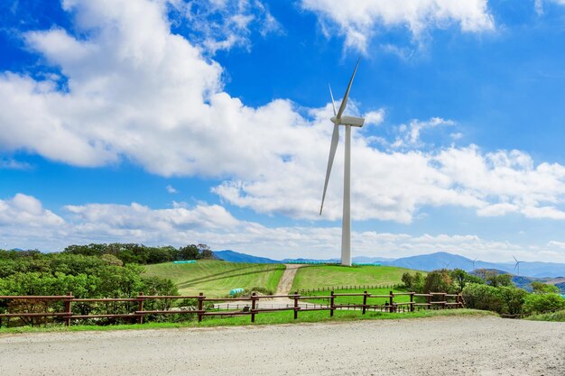 Photo windmill on field against sky