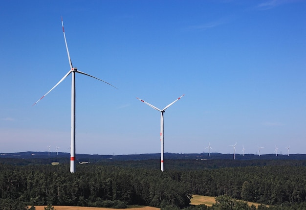 Photo windmill on field against sky