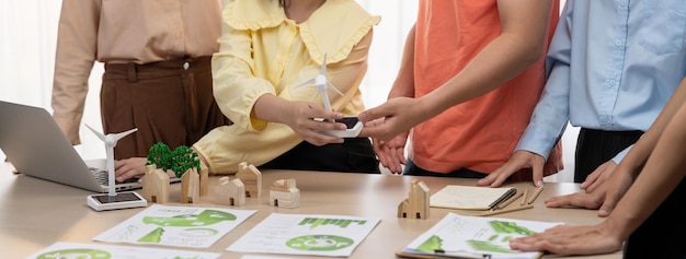 Photo windmill model placed during presenting green business closeup delineation