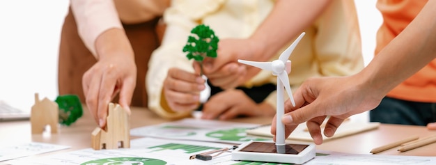 Photo windmill model placed during presenting green business closeup delineation