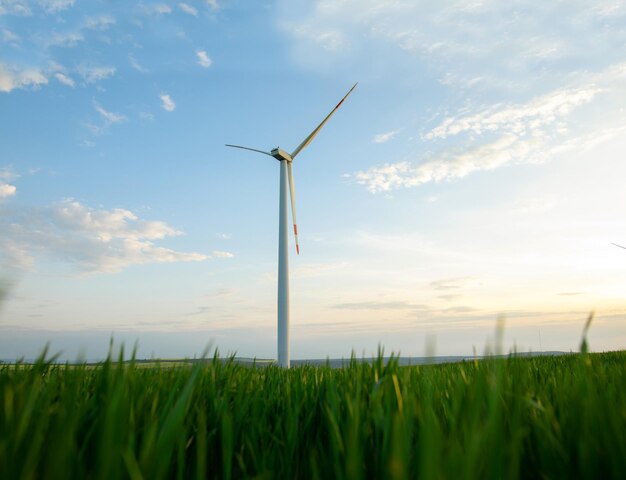 Photo windmill turbine generating green energy electric