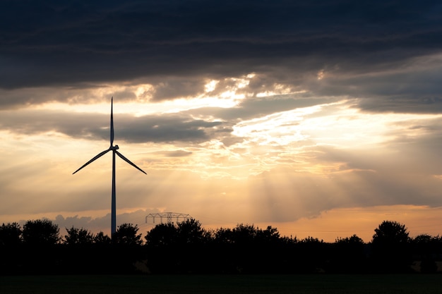 Windmill with cloudy evening sky in the background